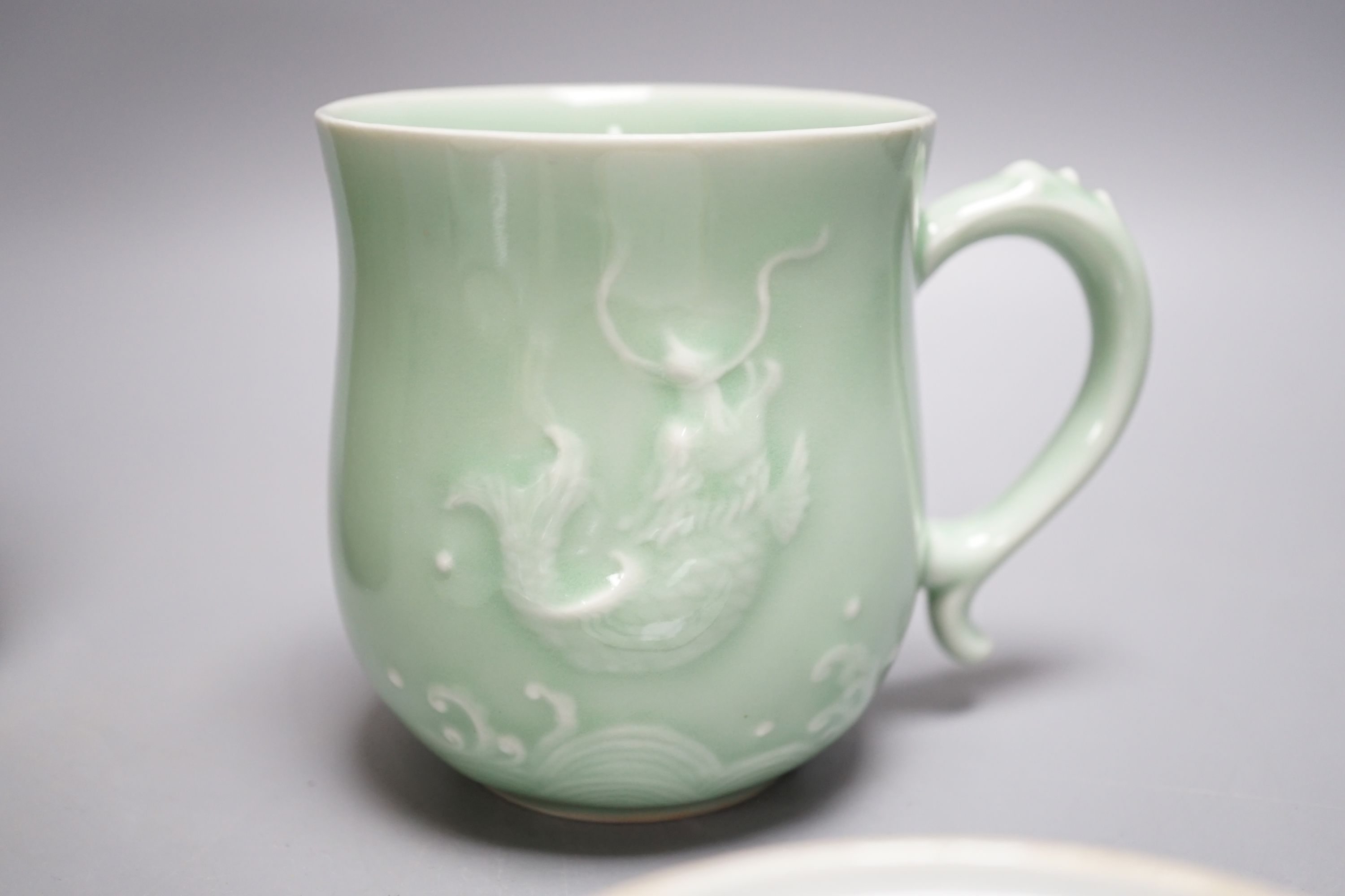 Two Chinese blue and white export dishes, a celadon cup and green glazed pottery vase, Export dishes 16,5 cms diameter.